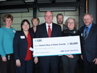QBE employees present a check to The United Way of Dane County.